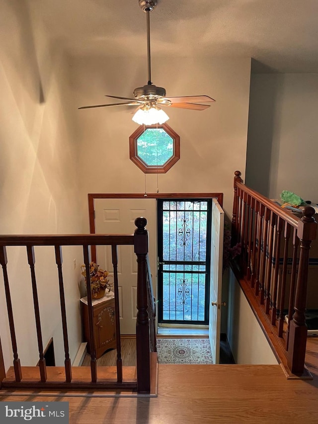 foyer entrance featuring hardwood / wood-style floors and ceiling fan