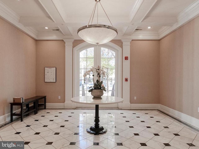 entryway featuring ornate columns, coffered ceiling, and beam ceiling