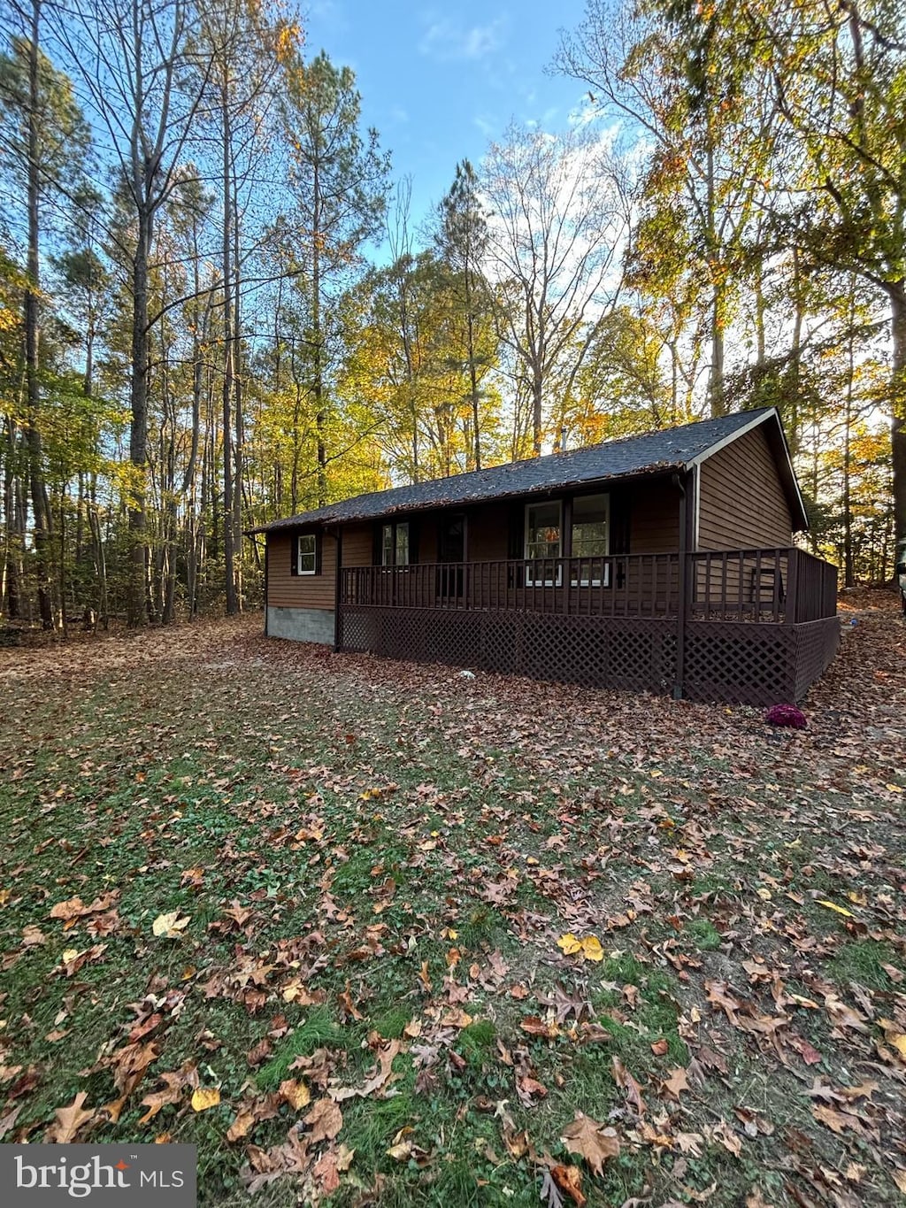 back of house with a wooden deck