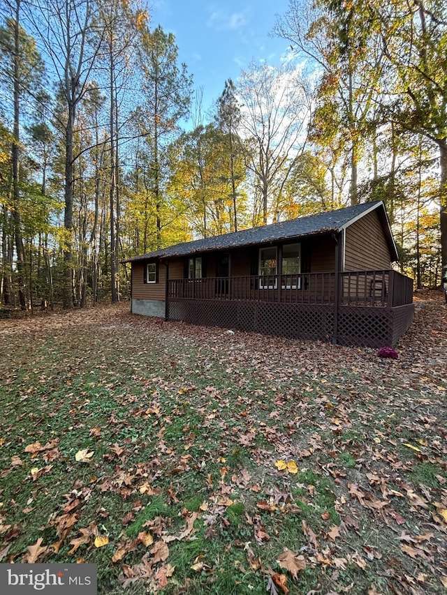 back of house with a wooden deck