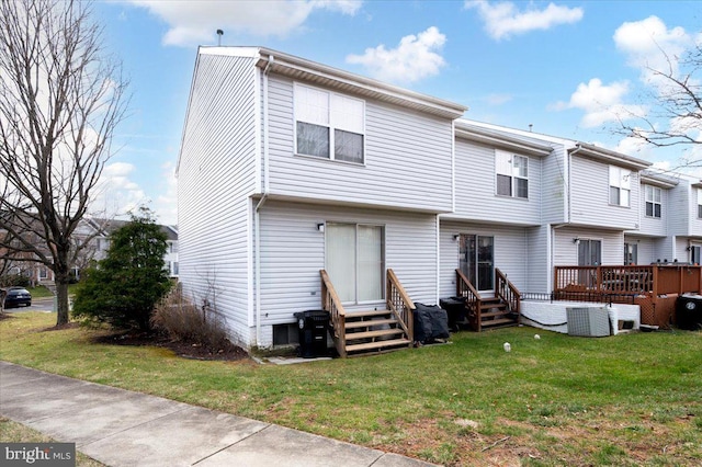 rear view of property with a yard