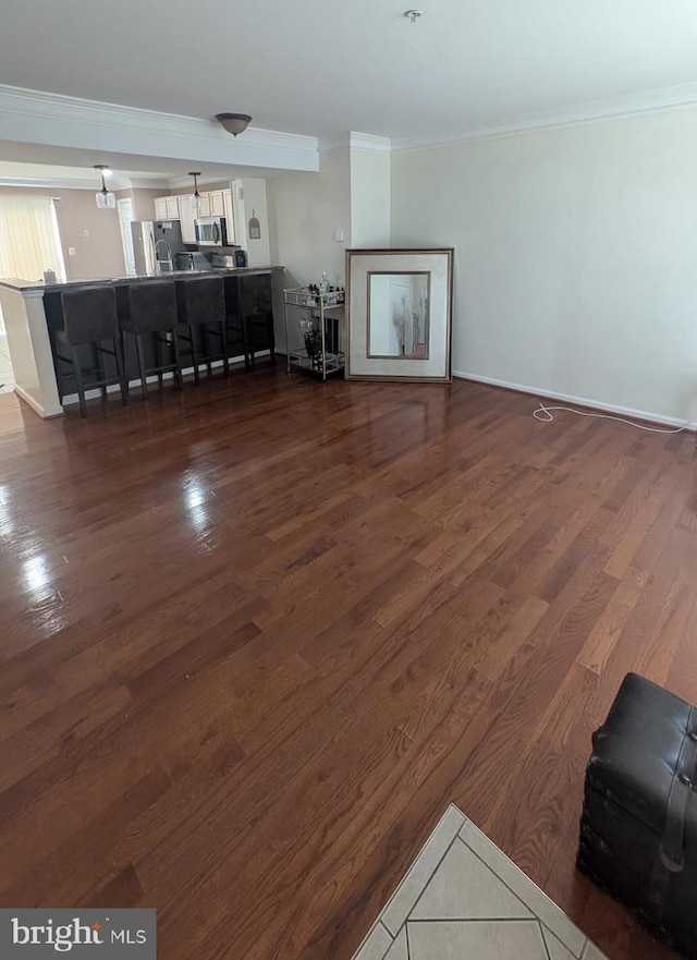 living room featuring crown molding and dark wood-type flooring