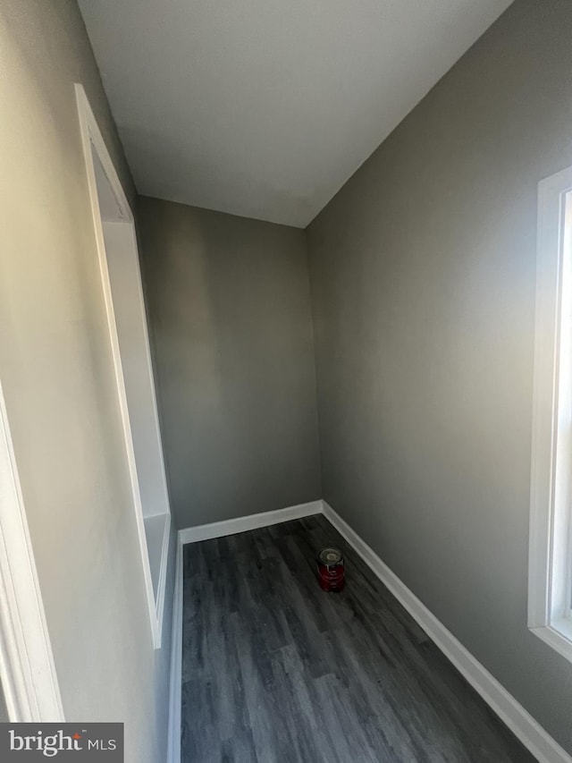 empty room with dark hardwood / wood-style floors