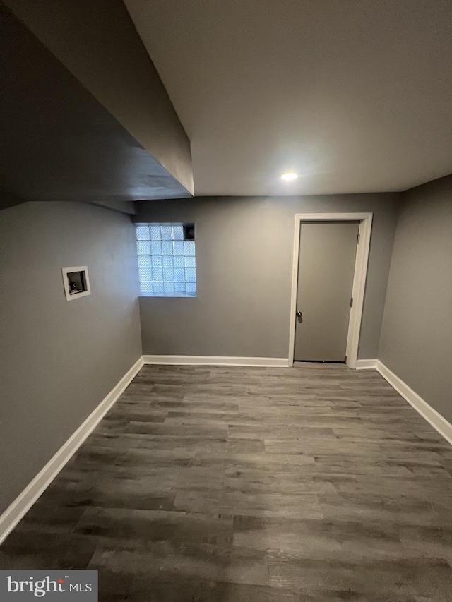 basement featuring hardwood / wood-style floors