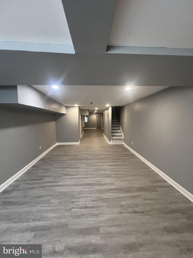 444 E 28th St, Baltimore, MD 21218 - finished basement featuring stairway, baseboards, and wood finished floors