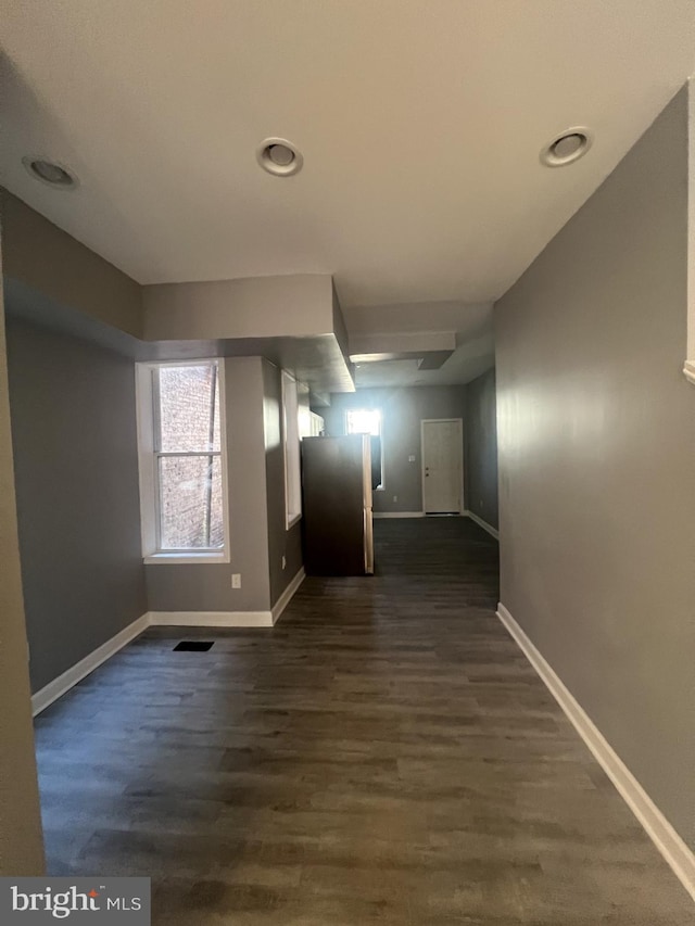 hallway with dark wood-type flooring