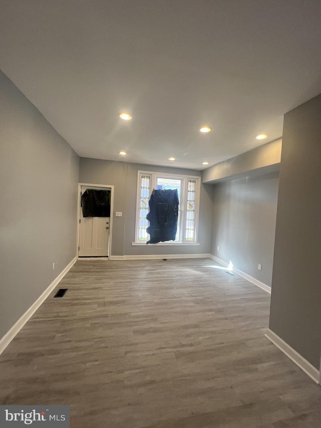 444 E 28th St, Baltimore, MD 21218 - unfurnished living room with recessed lighting, baseboards, visible vents, and wood finished floors