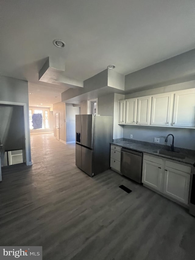 444 E 28th St, Baltimore, MD 21218 - kitchen featuring dark wood-style floors, recessed lighting, white cabinetry, a sink, and appliances with stainless steel finishes
