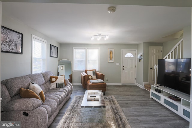 living room with dark hardwood / wood-style flooring