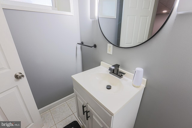 bathroom with tile patterned flooring and vanity