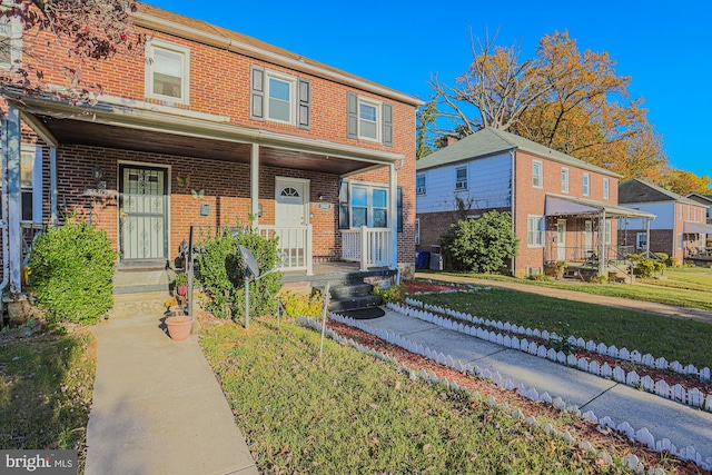 view of front of house featuring a front lawn and a porch