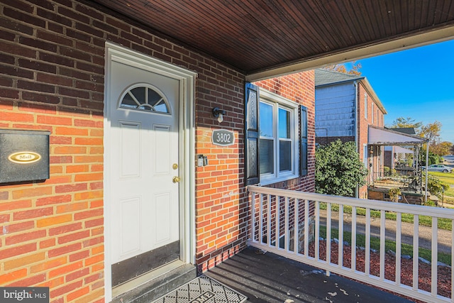 property entrance featuring covered porch