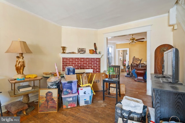 miscellaneous room with dark hardwood / wood-style flooring, ceiling fan, and ornamental molding