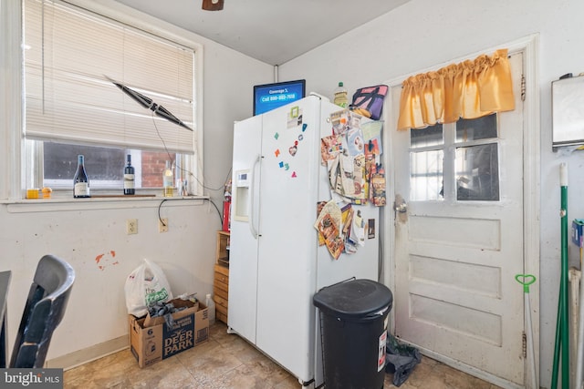 kitchen with white fridge with ice dispenser