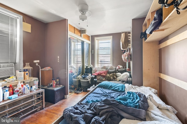 bedroom featuring ceiling fan and wood-type flooring