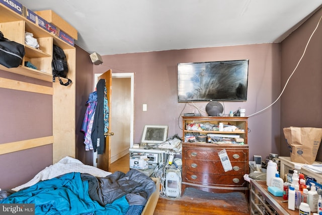 bedroom with hardwood / wood-style floors