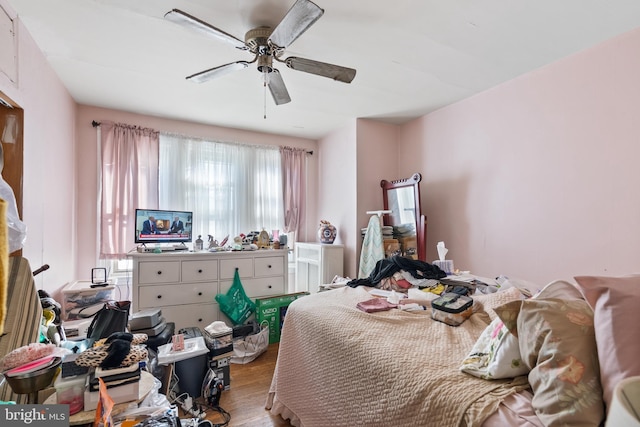 bedroom featuring ceiling fan and light hardwood / wood-style flooring