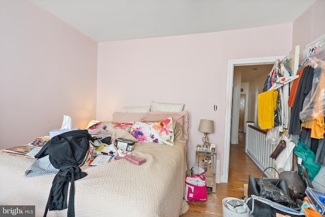 bedroom with wood-type flooring