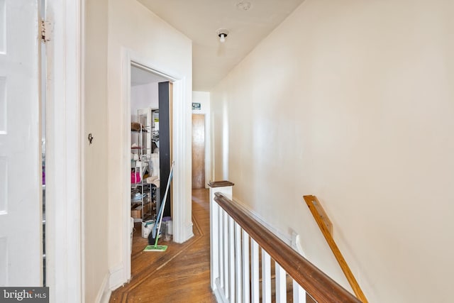 hallway with hardwood / wood-style flooring