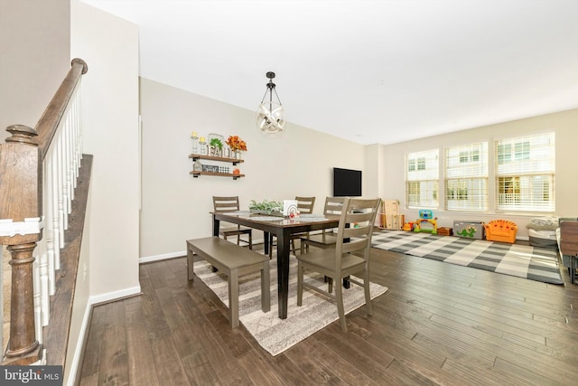 dining area with dark wood-type flooring