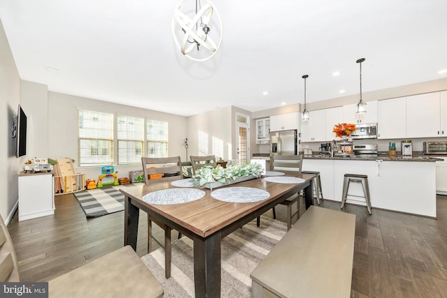 dining area with dark wood-type flooring and sink