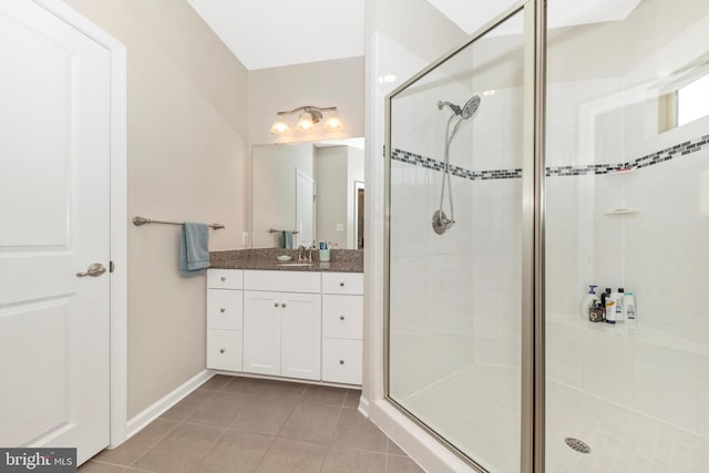 bathroom with vanity, walk in shower, and tile patterned floors