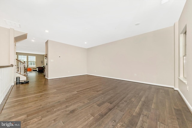 unfurnished living room featuring wood-type flooring