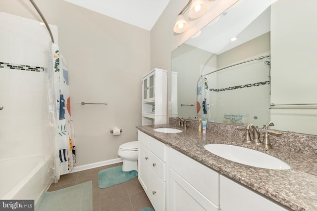 full bathroom with vanity, toilet, tile patterned floors, and shower / tub combo