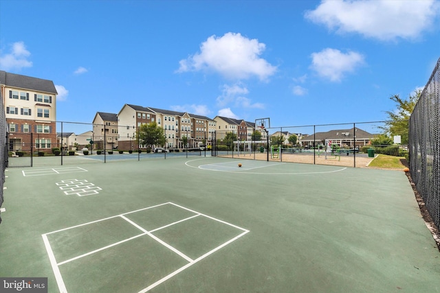 view of property's community featuring basketball court