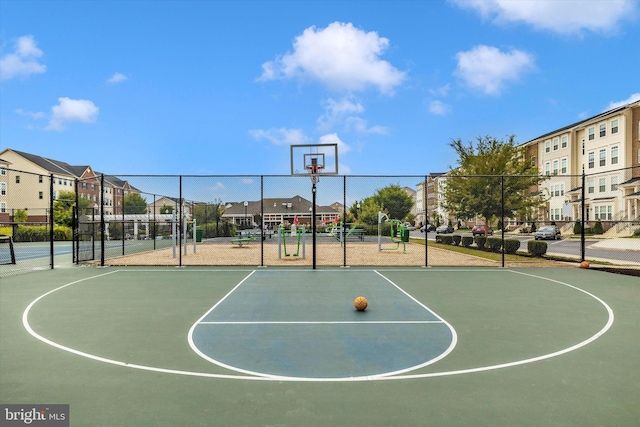 view of sport court featuring a playground