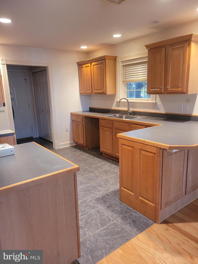 kitchen featuring sink and dark hardwood / wood-style flooring