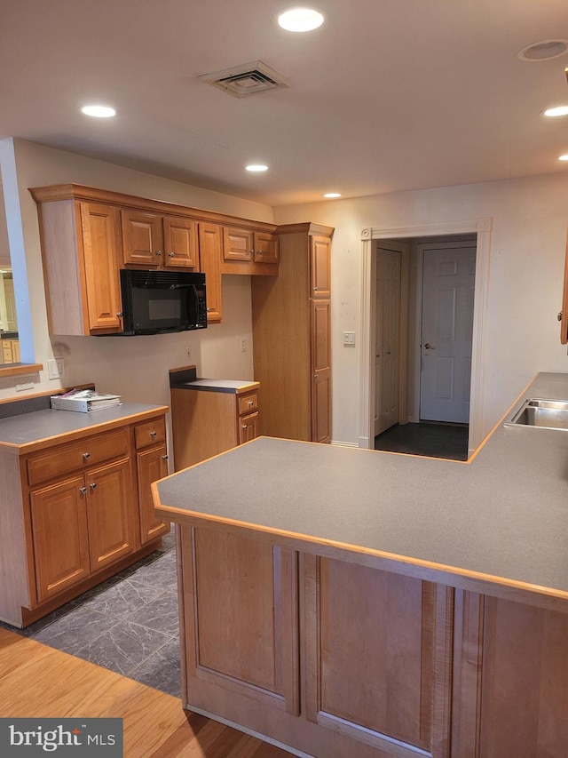 kitchen featuring dark wood-type flooring