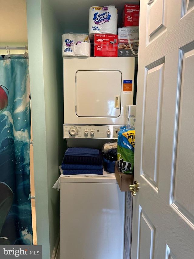 230 Holmes Rd, Holmes, PA 19043 - washroom featuring stacked washer / dryer and laundry area