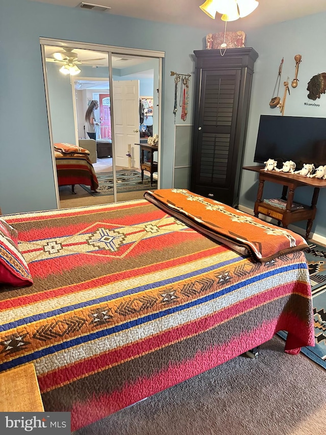 carpeted bedroom with a closet