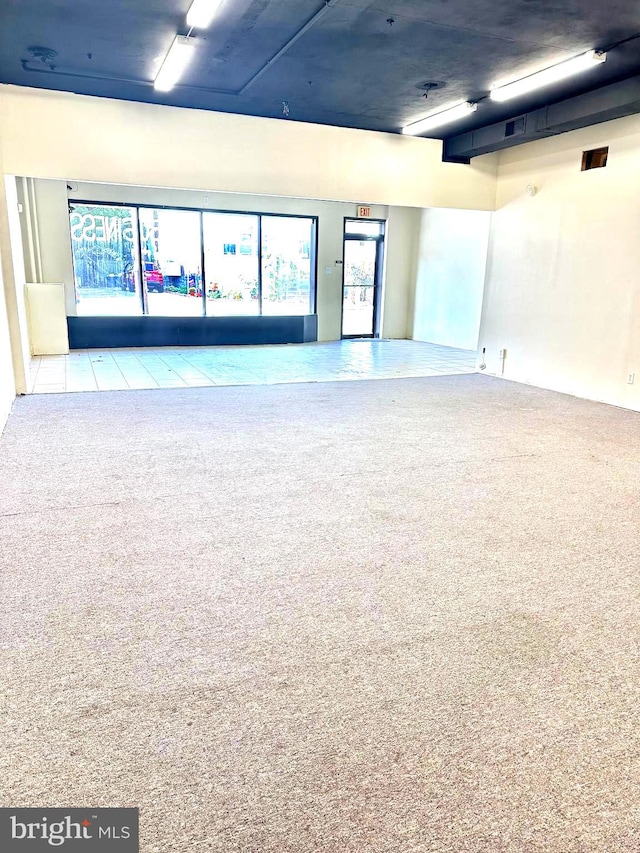 empty room featuring light colored carpet