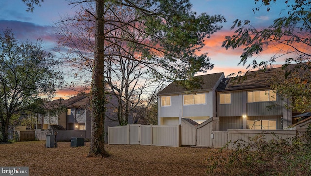 property exterior at dusk with fence