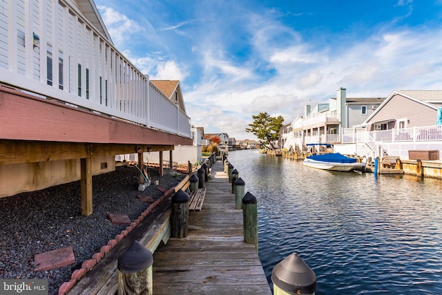 dock area with a water view