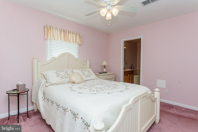 bedroom featuring carpet flooring, ceiling fan, and ensuite bath