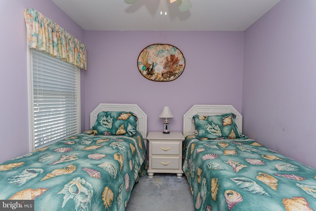 bedroom featuring light colored carpet and ceiling fan