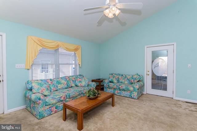 carpeted living room featuring ceiling fan and vaulted ceiling