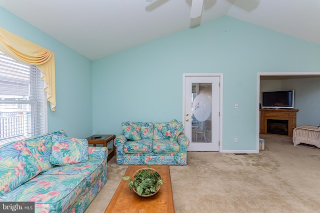 carpeted living room featuring lofted ceiling and ceiling fan