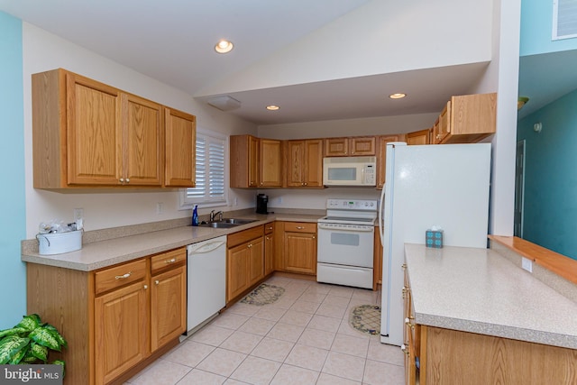 kitchen with light tile patterned floors, white appliances, sink, and lofted ceiling