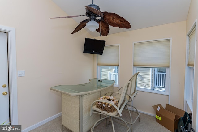 office space featuring ceiling fan and light carpet