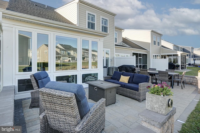 view of patio with outdoor lounge area and a grill