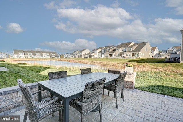 view of patio featuring a water view