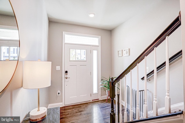 entryway with dark wood-type flooring