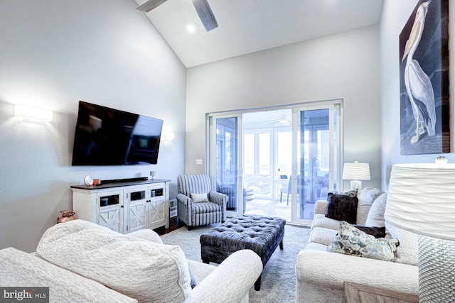 living room featuring high vaulted ceiling and ceiling fan