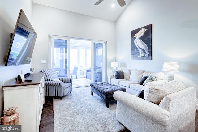 living room with ceiling fan, high vaulted ceiling, and dark hardwood / wood-style flooring