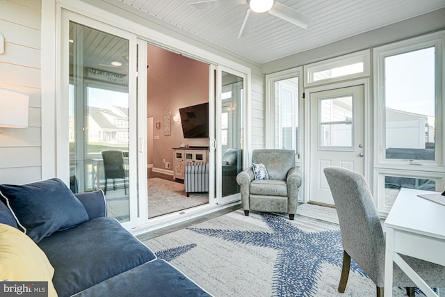 sunroom / solarium with radiator heating unit and ceiling fan