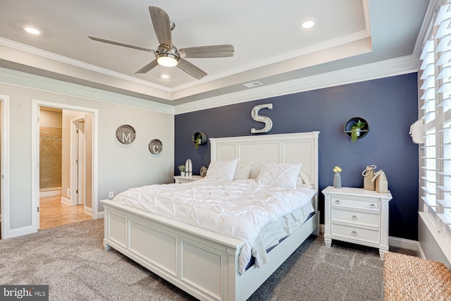 bedroom with connected bathroom, ceiling fan, ornamental molding, and dark colored carpet